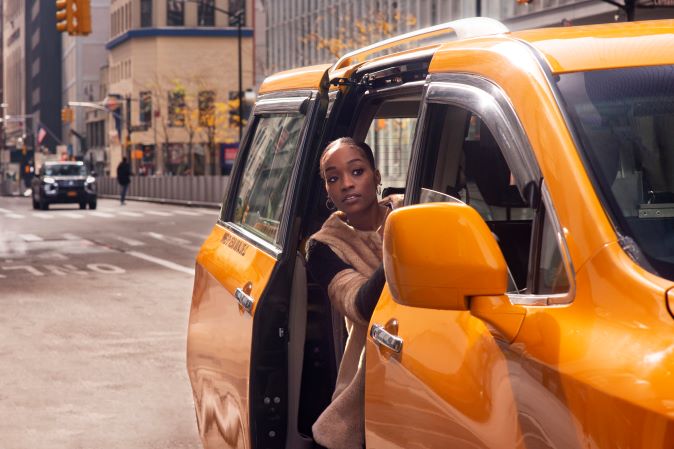 woman using eletric car travl city